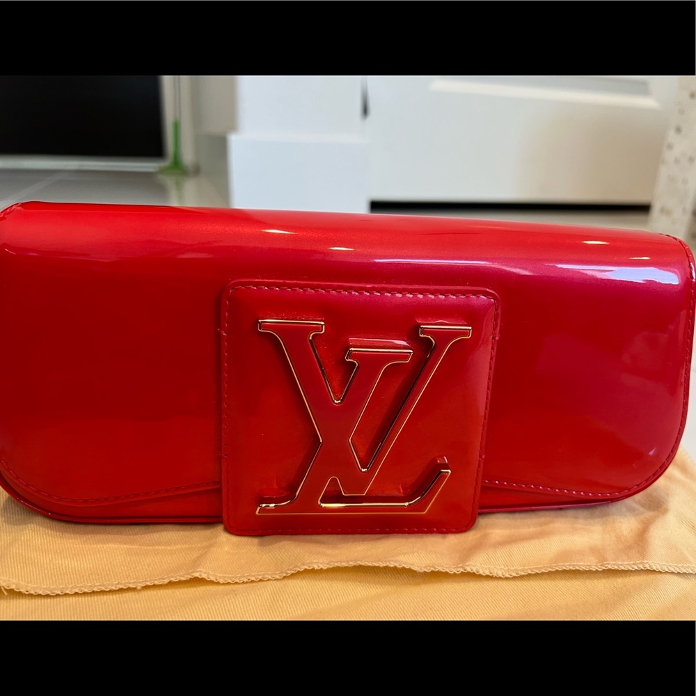 Brand New Louis Vuitton Sobe clutch Orange Sunset color